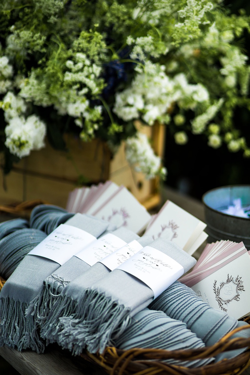 Light Blue Pashminas with Custom Labels
Photography: Roey Yohai Studios
Read More:
http://www.insideweddings.com/weddings/romantic-new-york-real-wedding-with-upscale-summer-camp-feel/1327/ wedding ceremony favors ceremony programs and custom labels on light blue pashmina shawl