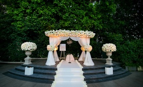 Floral-Embellished Chuppah
Photography: Callaway Gable
Read More:
http://www.insideweddings.com/weddings/sunset-ceremony-neutral-toned-ballroom-reception-in-beverly-hills/578/ Outdoor ceremony with stone platform and white chuppah with flowers