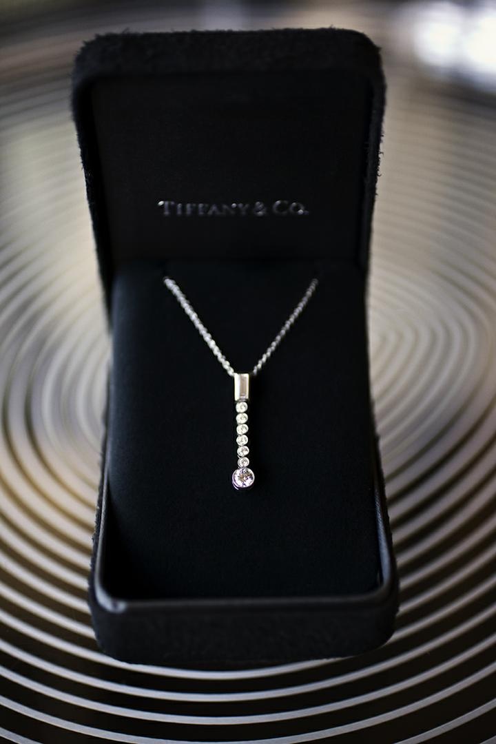 Graduated Drop Pendant
Photography: Catherine Hall Studios
Read More:
http://www.insideweddings.com/weddings/metropolitan-san-francisco-wedding-at-luxury-hotel/411/ Tiffany & Co. diamond jewelry in black box