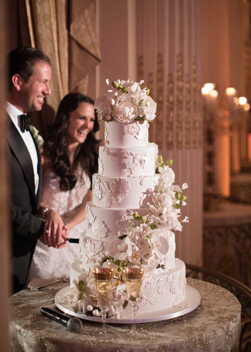 Six-Layer Cake with Sugar Flowers
Photography: The Day by Ira Lippke
Read More:
http://www.insideweddings.com/weddings/opulent-luxury-wedding-with-timeless-color-palette-in-new-york-city/1199/ wedding reception cake ron ben israel lace design sugar flowers cascading down with topper