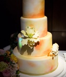 Ombré Wedding Cake with Flowers
Photography: Roey Yohai Photography
Read More:
http://www.insideweddings.com/weddings/colorful-fall-wedding-with-modern-details-in-new-york-city/971/ Four layer ombre wedding cake orange and yellow with sugar flower and dog replica on side wedding
