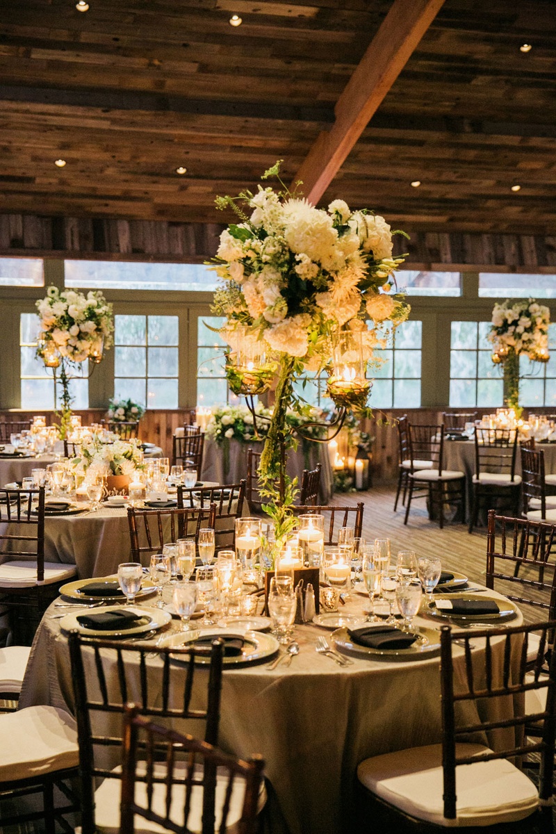 Centerpieces Resting on Wrought Iron Candelabra
Photography: This Modern Romance
Read More:
http://www.insideweddings.com/weddings/rustic-chic-wedding-with-wooden-accents-and-verdant-details/861/ rod iron candelabra centerpieces hydrangea roses lisianthus veronica dahlias Queen Anne's lace