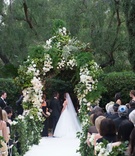 Bride %26 Groom Under Verdant Chuppah
Photography: John Solano Photography
Read More:
http://www.insideweddings.com/weddings/an-opulent-garden-ceremony-ballroom-reception-in-beverly-hills/986/ Bride in Monique Lhuillier wedding dress under chuppah of greenery and white flowers garlands hedge