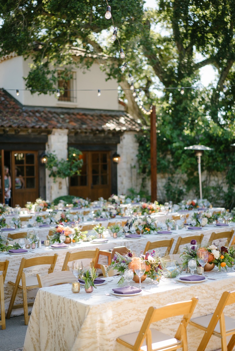 Rows of Tables with Patterned Linens
Photography: Karlisch Photography
Read More:
http://www.insideweddings.com/weddings/modern-rustic-wedding-full-of-flowers-and-geometric-details/906/ long family style tables with ivory and gold patterned linens, low centerpieces