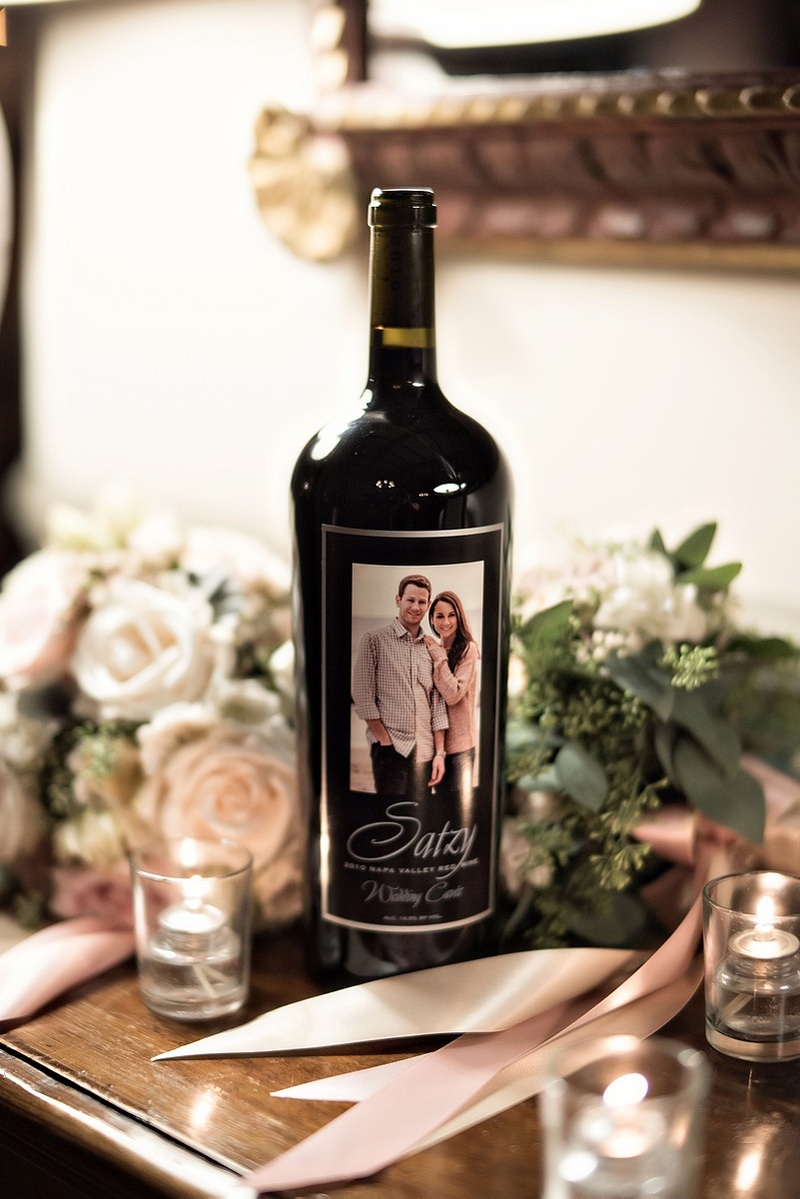 Personalized Wine Bottle
Photography: Laurie Bailey Photography
Read More:
http://www.insideweddings.com/weddings/oceanfront-wedding-ceremony-classic-romantic-ballroom-reception/854/ personalized wine bottle on display at wedding with engagement photo as label