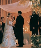 Gold and White Ceremony
Photography: Dalal Photography
Read More:
http://www.insideweddings.com/weddings/old-world-elegance-at-classic-ballroom-wedding-in-san-francisco/85/ bride and groom stand under chuppah
