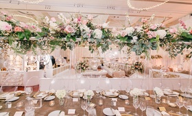 Green, Pink, and Ivory Tall Centerpiece
Photography: Switzerfilm
Read More:
http://www.insideweddings.com/weddings/rooftop-ceremony-with-city-views-dreamy-reception-in-st-louis/844/ Tall wedding centerpiece at wedding reception clear vase, green leaves, pink rose, white hydrangea