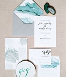 Watercolor %26 Palm Invitation Suite
Photography: Branco Prata
Read More:
http://www.insideweddings.com/weddings/chic-destination-wedding-with-california-style-in-washington-dc/1042/ Grey envelope with teal envelope liner and invitation Minted with palm leaf print calligraphy