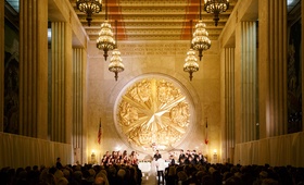 Historical Venue Wedding Ceremony
Photography: Karlisch Photography
Read More:
http://www.insideweddings.com/weddings/a-festive-new-years-eve-wedding-at-an-art-deco-venue-in-dallas/1053/ Bride and groom at altar gold texas emblem chandeliers overhead hall of state venue in texas dallas