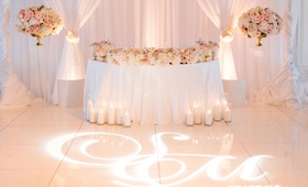 Sweetheart Table with Perfect View of Dance Floor
Photography: Birds of a Feather
Read More:
http://www.insideweddings.com/weddings/church-ceremony-sparkling-pink-ballroom-reception-with-city-views/1084/ Wedding reception pink and gold white color palette lighting design gobo monogram on dance floor