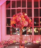 Pink %26 Orange Centerpiece
Photography: Punam Bean
Read More:
http://www.insideweddings.com/weddings/brightly-colored-fall-wedding-in-new-york/317/ Gold centerpiece stand with pink and orange flowers