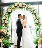 Passionate First Kiss
Photography: Kesha Lambert Photography
Read More:
http://www.insideweddings.com/weddings/personalized-ceremony-with-pink-florals-at-a-loft-in-new-york-city/1210/ bride grabs groom by the face for first married kiss under floral arch
