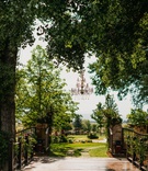 Garden Wedding at End of Private Drive
Photography: Our Two Hearts
Read More:
http://www.insideweddings.com/weddings/romantic-whimsical-outdoor-garden-wedding-reception-inspiration/1319/ wedding reception location bridge decorated with greenery and flowers garland garden wedding ideas