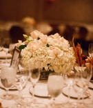 Centerpiece
Photography: Elizabeth Messina
Read More:
http://www.insideweddings.com/weddings/timeless-all-white-wedding-in-beverly-hills-california/295/ Wedding reception centerpiece of white hydrangea and pale peach roses