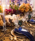 Periwinkle Candle with Vibrant Florals
Photography: Duke Photography
Read More:
http://www.insideweddings.com/weddings/dramatic-tablescape-at-launch-party-for-luxe-linens-newest-line/987/ wedding styled shoot, periwinkle tapered candles, bright flowers teal glassware, black & gold linens