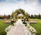 Verdant Arch Over Wood Aisle Runner