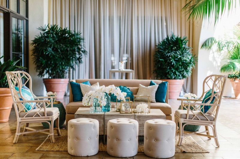 Cocktail Hour Beachy Lounge
Photography: Braedon Photography
Read More:
http://www.insideweddings.com/weddings/orthodox-jewish-wedding-with-outdoor-ceremony-inspired-by-the-sea/812/ Ocean inspired wedding wicker armchair white pouf, blue tan pillows, orchid decorations on table
