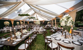Tented Wedding with Alabaster Drapery
Photography: Paul Barnett Photography
Read More:
http://www.insideweddings.com/weddings/fall-wedding-with-outdoor-ceremony-tented-reception-in-california/1220/ wedding reception alabaster drapery tent venue wood table round tables white centerpiece