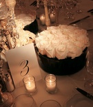 Table Number and Centerpiece
Photography: la Storia foto
Read More:
http://www.insideweddings.com/weddings/chic-all-white-wedding-at-the-four-seasons-hotel-chicago/232/ Wedding reception table number and round, white rose centerpiece