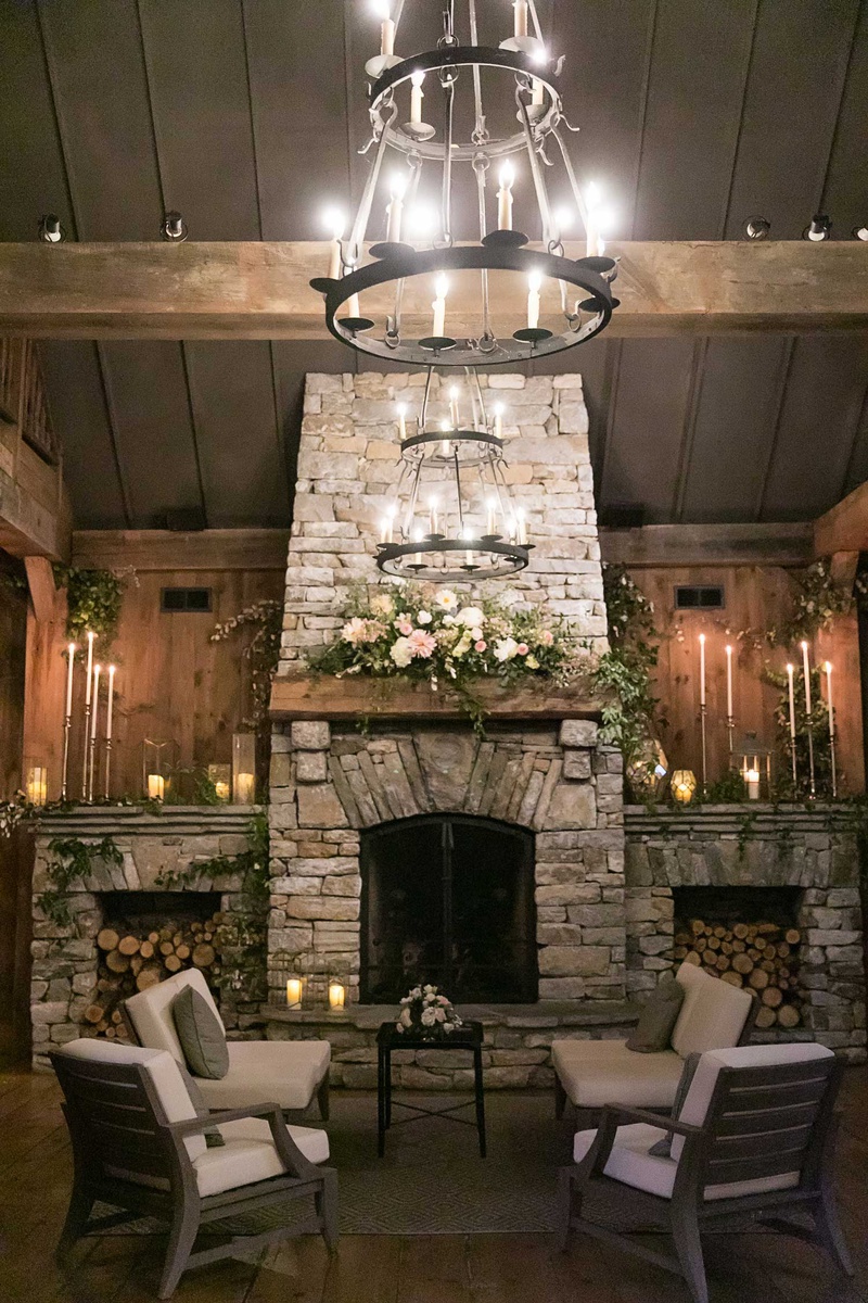 Rustic Venue Lounge Area
Photography: Vue Photography
Read More:
http://www.insideweddings.com/weddings/destination-rustic-fall-wedding-at-a-farm-in-north-carolina/1202/ wedding reception lounge wood stacked fireplace mantle with pink white flowers greenery chandeliers