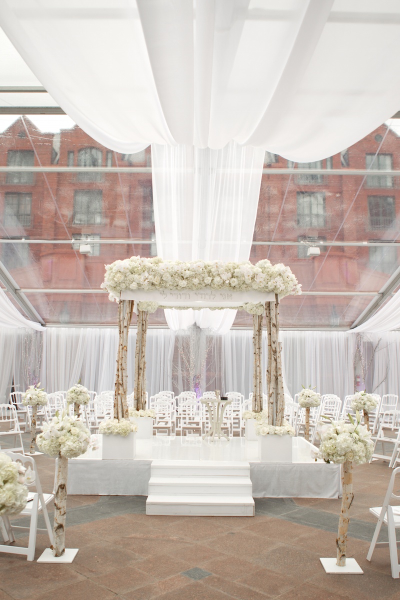 Wintry Ceremony Décor
Photography: Aaron Delesie Photographer
Read More:
http://www.insideweddings.com/weddings/snowy-spring-celebration-in-aspen-colorado/596/ Birch tree chuppah under clear ceiling panels