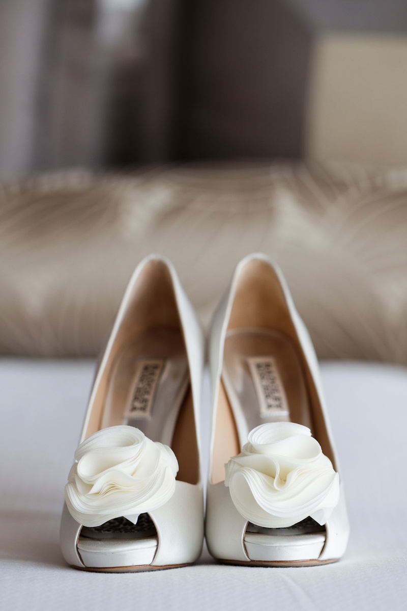 Flower Details on Peep-Toe Pumps
Photography: Bob %26 Dawn Davis Photography
Read More:
http://www.insideweddings.com/weddings/church-ceremony-colorful-tented-reception-at-a-private-residence/1025/ Bride's wedding shoes white badgley mischka shoes white flower detail on peep toe