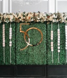 Hedge Wall with Escort Cards
Photography: Jessica Claire Photography
Read More:
http://www.insideweddings.com/weddings/50th-anniversary-party-with-fall-foliage-and-unique-performances/1068/ green hedge wall with escort cards and gold interlocking number for 50th anniversary