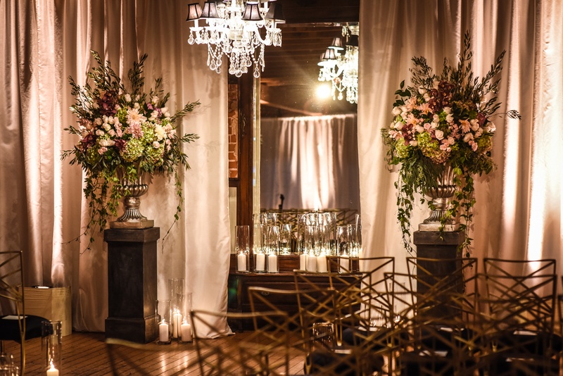 Ceremony Floral Arrangements in Fall Colors
Photography: Joe Photo
Read More:
http://www.insideweddings.com/weddings/the-unique-and-intimate-wedding-of-trains-bassist-hector-maldonado/879/ blush, burgundy, green floral arrangement on stand with crystal chandelier at ceremony