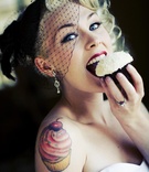 Bride Eats Cupcake
Photography: Barnet Photography
Read More:
http://www.insideweddings.com/weddings/ashley-reeves-and-brandon-saller/261/ Bride in a black wedge veil eats a Sprinkles cupcake