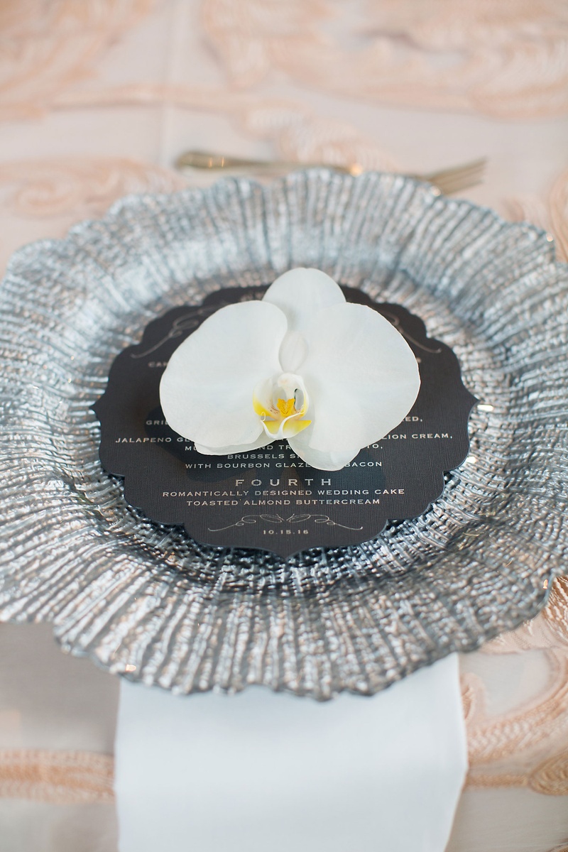 White Orchid on Silver Place Setting
Photography: Sarah Kate, Photographer
Read More:
http://www.insideweddings.com/weddings/outdoor-fall-ceremony-opulent-tented-reception-in-dallas-texas/1022/ Wedding reception silver charger plate round menu card white phalaenopsis orchid