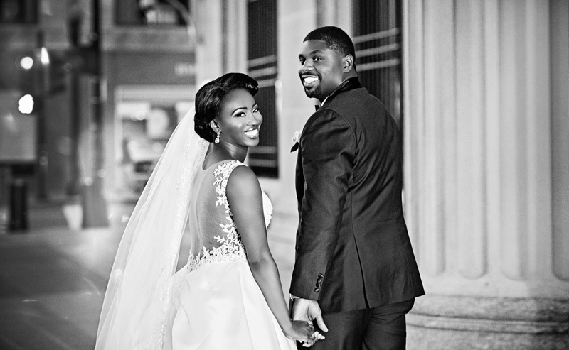 Mercy Odueyungbo %26 Antonio Jackson
Photography: Carasco Photography
Read More:
http://www.insideweddings.com/weddings/church-ceremony-with-nigerian-traditions-chic-ballroom-reception/845/ Black and white photo of African American couple getting married in Chicago bride in illusion back