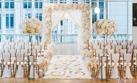 Lush Swirl Flower Aisle on Wood Floor
Photography: Crystal Stokes Photography
Read More:
http://www.insideweddings.com/weddings/white-blush-inspirational-wedding-shoot-at-urban-rooftop-garden/714/ Wedding ceremony with city views and white, blush decor, wood floor with white petals