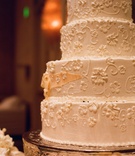 Wedding Cake
Photography: Elizabeth Messina
Read More:
http://www.insideweddings.com/weddings/timeless-all-white-wedding-in-beverly-hills-california/295/ White wedding cake decorated with flowers and filigree