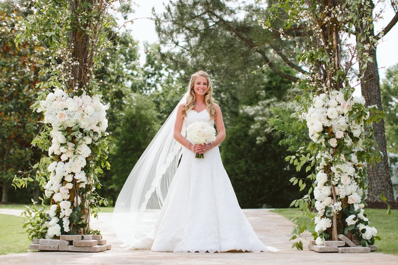 Elegant Bridal Look
Photography: David %26 Tammy Molnar
Read More:
http://www.insideweddings.com/weddings/an-exquisite-backyard-wedding-in-tennessee/532/ Bride under floral archway in A-line wedding dress