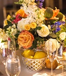 Florals Inspired by Still-Life Painting
Photography: Carasco Photography
Read More:
http://www.insideweddings.com/weddings/chicago-wedding-inspired-by-still-life-paintings-at-an-art-museum/1102/ Wedding reception low centerpiece with basket filled with lemon pears orange and yellow flowers
