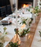 Copper Table Runner with Greenery and Candles
Photography: Blue Rose Photography
Read More:
http://www.insideweddings.com/weddings/urban-chic-styled-wedding-shoot-with-unique-copper-accents/785/ a copper table runner with intricate pattern under small white and green floral arrangements