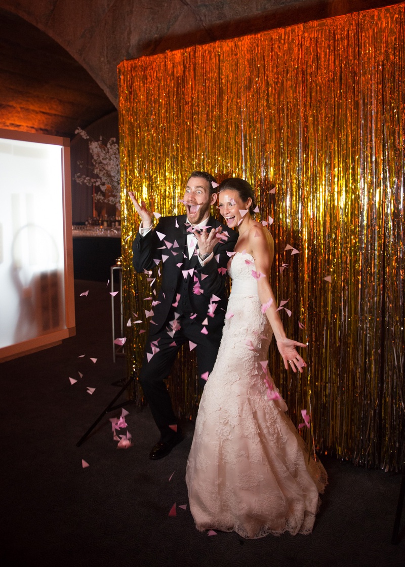 Couple Strike Playful Pose and Throw Petals
Photography: Ira Lippke Studios
Read More:
http://www.insideweddings.com/weddings/chic-classic-new-york-city-wedding-with-personal-touches/783/ newlyweds strike a silly and playful pose for their photo booth and throw pink flower petals