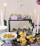 Black, White %26 Purple Food Display
Photography: Laura Gordon
Read More:
http://www.insideweddings.com/weddings/inspirational-spring-fete-with-moody-florals-modern-details/1182/ wedding event food display calzone on mini armchair, chicken sandwiches, black white stripes