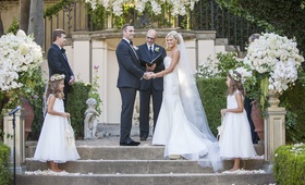 Couple Marrying in Courtyard of Estate
Photography: Lane Dittoe Photography
Read More:
http://www.insideweddings.com/weddings/charming-wedding-at-california-estate-inspired-by-european-villa/817/ bride and groom officiant best man flower girls outdoor courtyard greenery white flowers ceremony