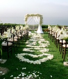 White Oceanfront Ceremony Décor
Photography: James Johnson Photography
Read More:
http://www.insideweddings.com/weddings/intimate-moroccan-themed-chateau-wedding-in-california/323/ White calla lily arrangements and rose petal hearts