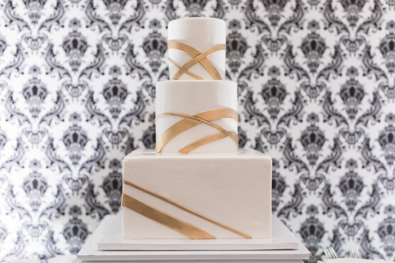 Modern Three-Tier Cake
Photography: Kristin Anderson
Read More:
http://www.insideweddings.com/weddings/classic-wedding-colors-with-modern-elements-in-santa-monica/1031/ three tier wedding cake with glassy finish and modern gold stripes
