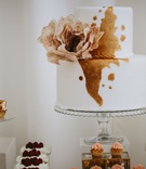 Two-Tier Cake with Copper Details
Photography: Atelier Kryjak
Read More:
http://www.insideweddings.com/weddings/autumn-glamour-inspirational-shoot-with-gilded-pumpkin-decor/1185/ small simple wedding cake white fondant with metallic copper rose gold detail flower decal