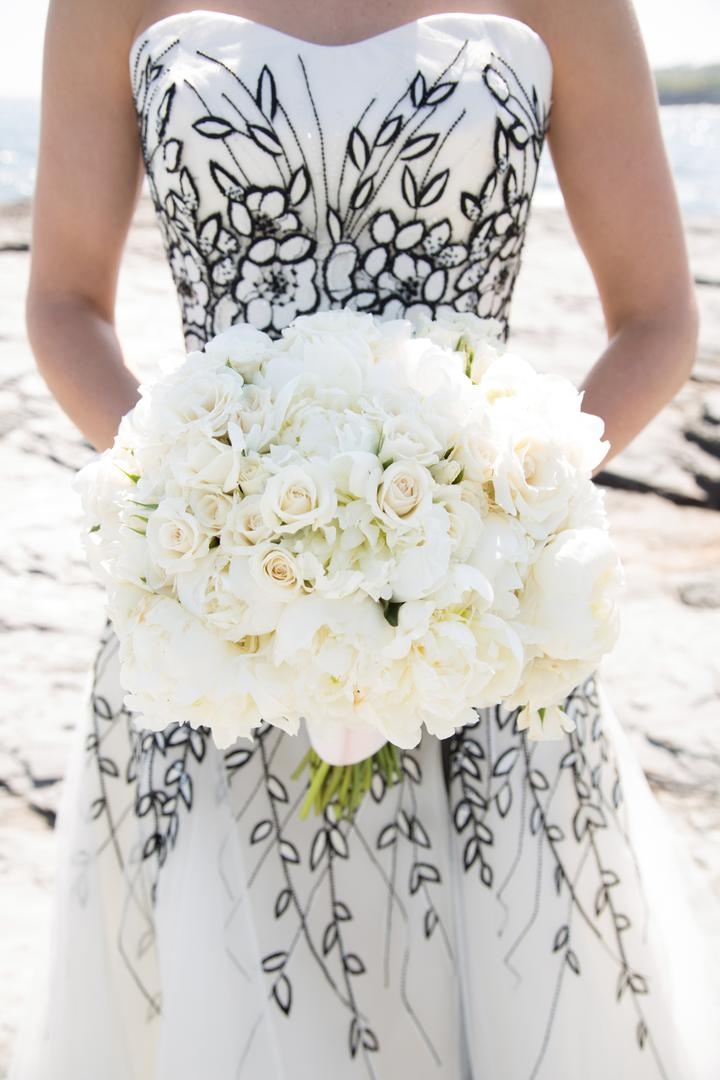 White Rose %26 Peony Bouquet
Photography: Carrie Rodman Photography
Read More:
http://www.insideweddings.com/weddings/new-england-summer-wedding-by-the-seashore/429/ Bride in black and white dress holds all-white bouquet