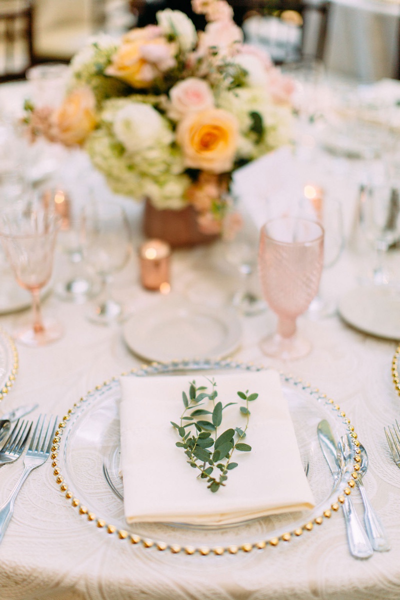 Fresh Greenery on Alfresco Place Setting
Photography: Ashley Paige Photography
Read More:
http://www.insideweddings.com/weddings/elegant-outdoor-fall-wedding-at-a-rustic-chic-venue-in-malibu/1244/ wedding reception gold bead charger plate pink glassware goblet orange pink flowers greenery