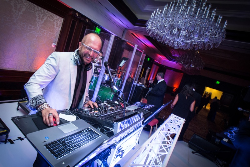 DJ Presiding Over the Dance Floor
Photography: Jay Lawrence Goldman Photography
Read More:
http://www.insideweddings.com/weddings/elegant-white-lavender-ballroom-wedding-with-cherry-blossom-trees/710/ Allen G. Orchestra playing Armenian & Middle Eastern Music at wedding reception
