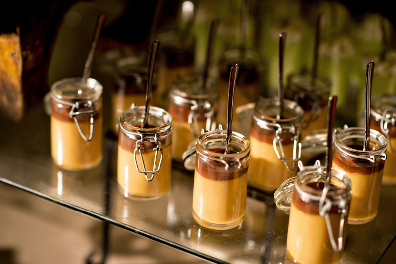 Chocolate And Caramel Pudding In Mini Mason Jars At Wedding Dessert Table Chocolate And Caramel Pudding In Mini Mason Jars At Wedding Dessert Table
