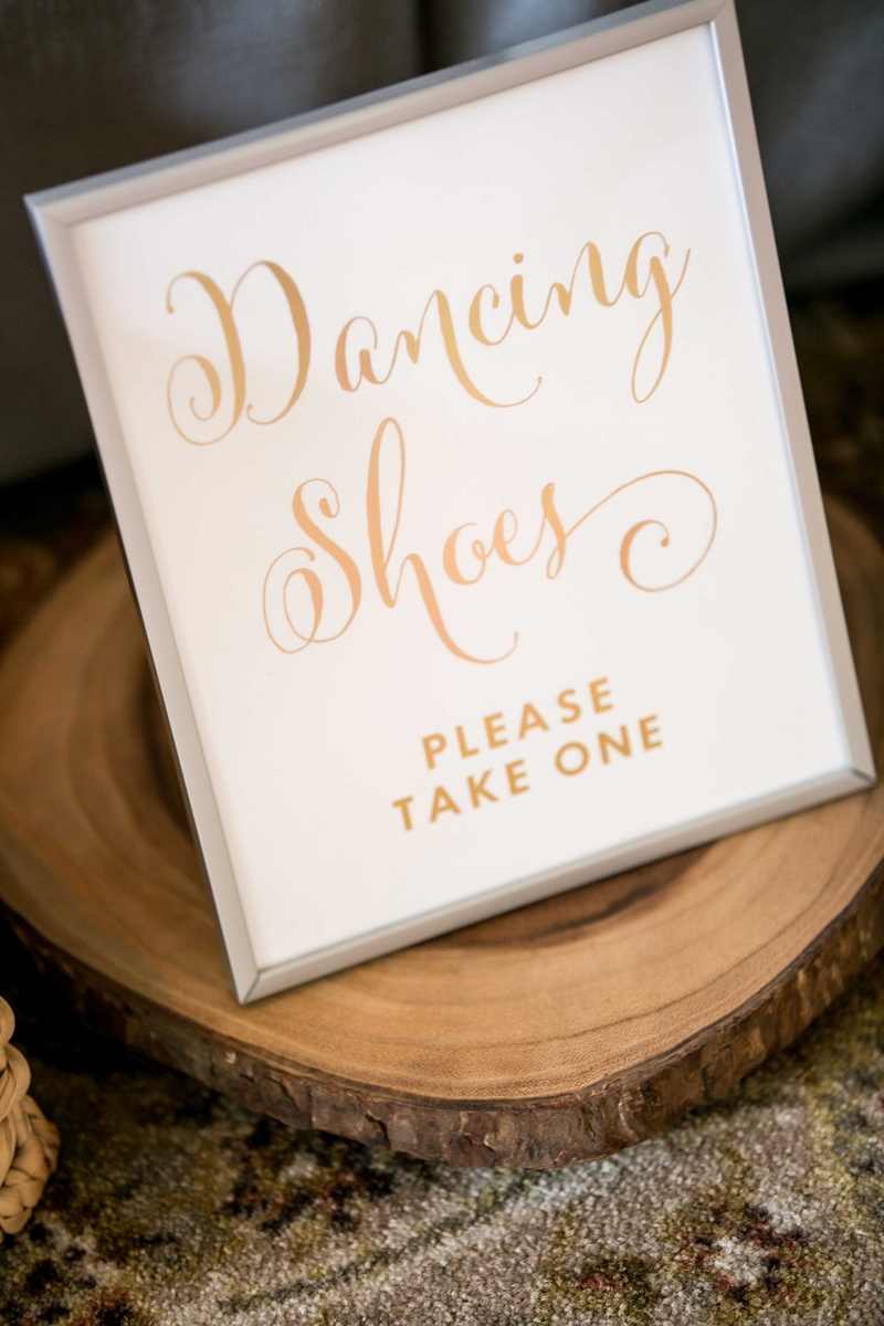 Sign for "Dancing Shoes"
Photography: Laurie Bailey Photography
Read More:
http://www.insideweddings.com/weddings/classic-california-wedding-with-outdoor-ceremony-indoor-reception/853/ wedding signage dancing shoes gold calligraphy, wooden slab tree trunk