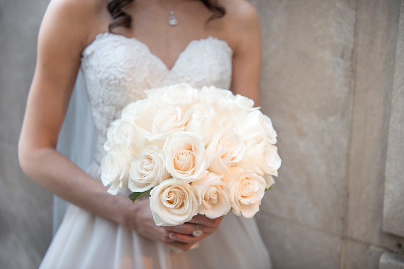 Bride Clutches Ivory Rose Bouquet
Photography: Carasco Photography
Read More:
http://www.insideweddings.com/weddings/jewish-wedding-with-classic-ivory-and-gold-decor-in-chicago/983/ bride in essence of australia wedding dress holds bridal bouquet of ivory roses