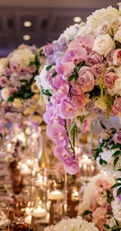 Lush Centerpiece with Pale Orchids
Photography: Amy Anaiz Photography
Read More:
http://www.insideweddings.com/weddings/luxe-springtime-wedding-inspiration-shoot-with-delectable-desserts/1120/ Wedding reception tall centerpiece purple orchid, white rose hydrangea, pink rose flowers floating
