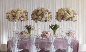 Lavender Spring-Inspired Tablescape
Photography: Collin Pierson Photography
Read More:
http://www.insideweddings.com/weddings/styled-spring-wedding-shoot-with-lavender-blush-silver-decor/1114/ Wedding styled shoot inspiration purple linen white chair drapery tall flower arrangements purple